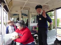 p1010651  The Tram Conductor telling us about the history of the village